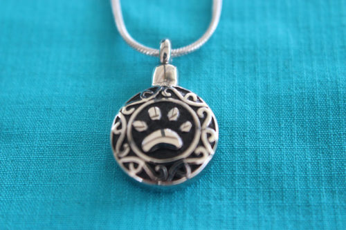 Paw print pendant for pet ashes